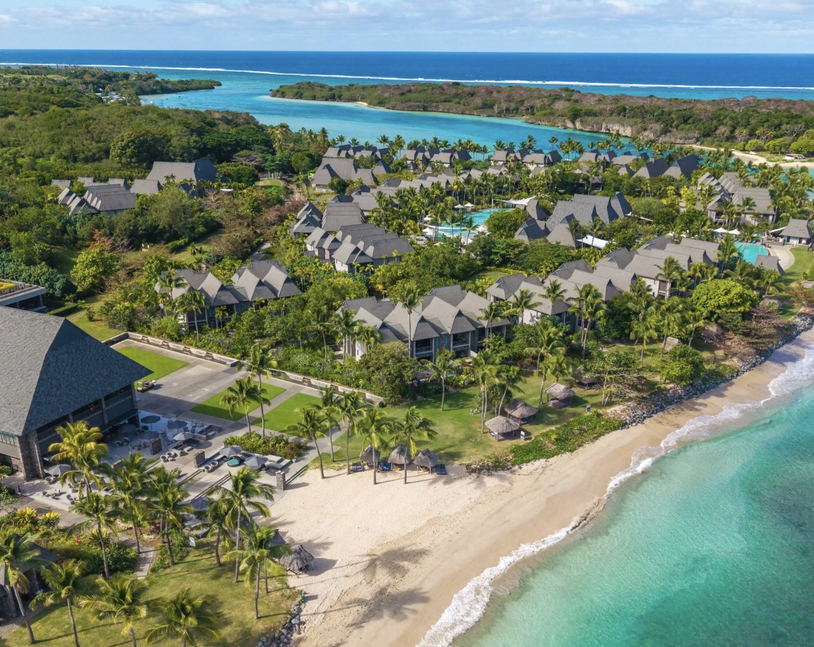 Aerial view along the beachfront accommodation towards the lagoon
