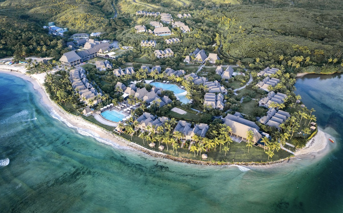 Aerial view of the beachfront resort with the Club accommodation on the hillside behind