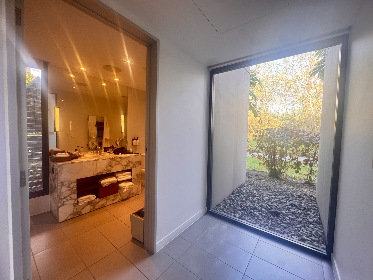 The second bathroom, beside a window overlooking the planting.