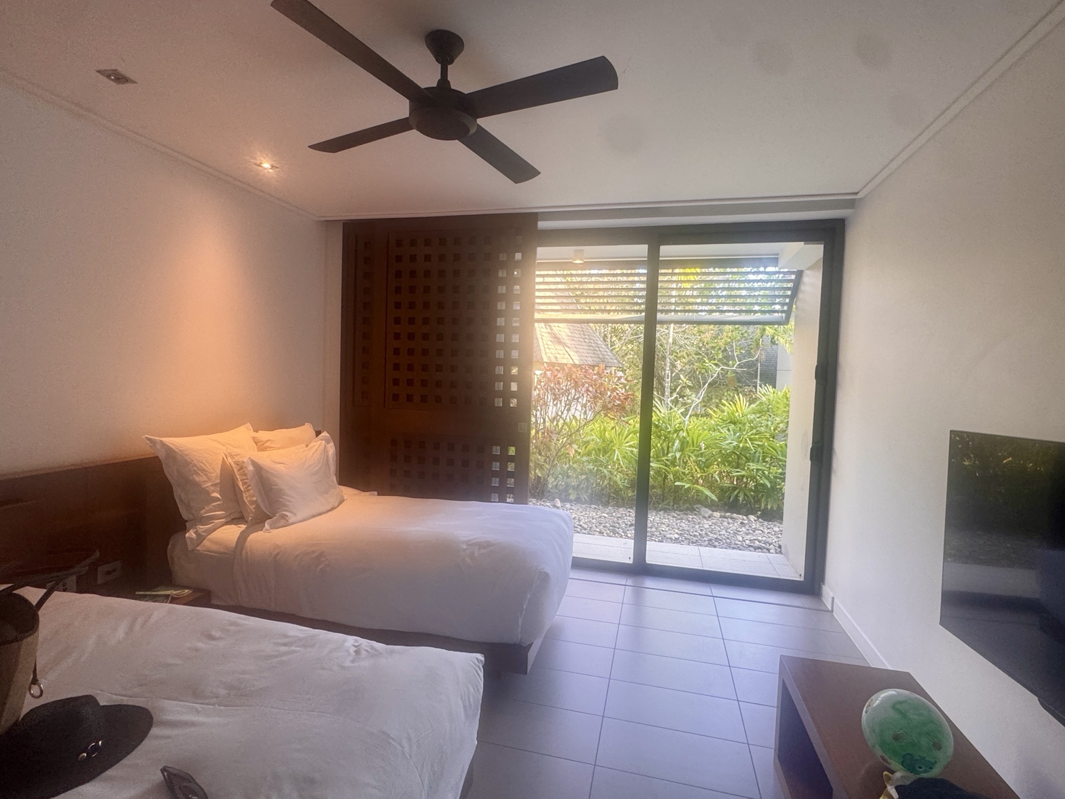 The second bedroom has twin beds and a garden outlook.